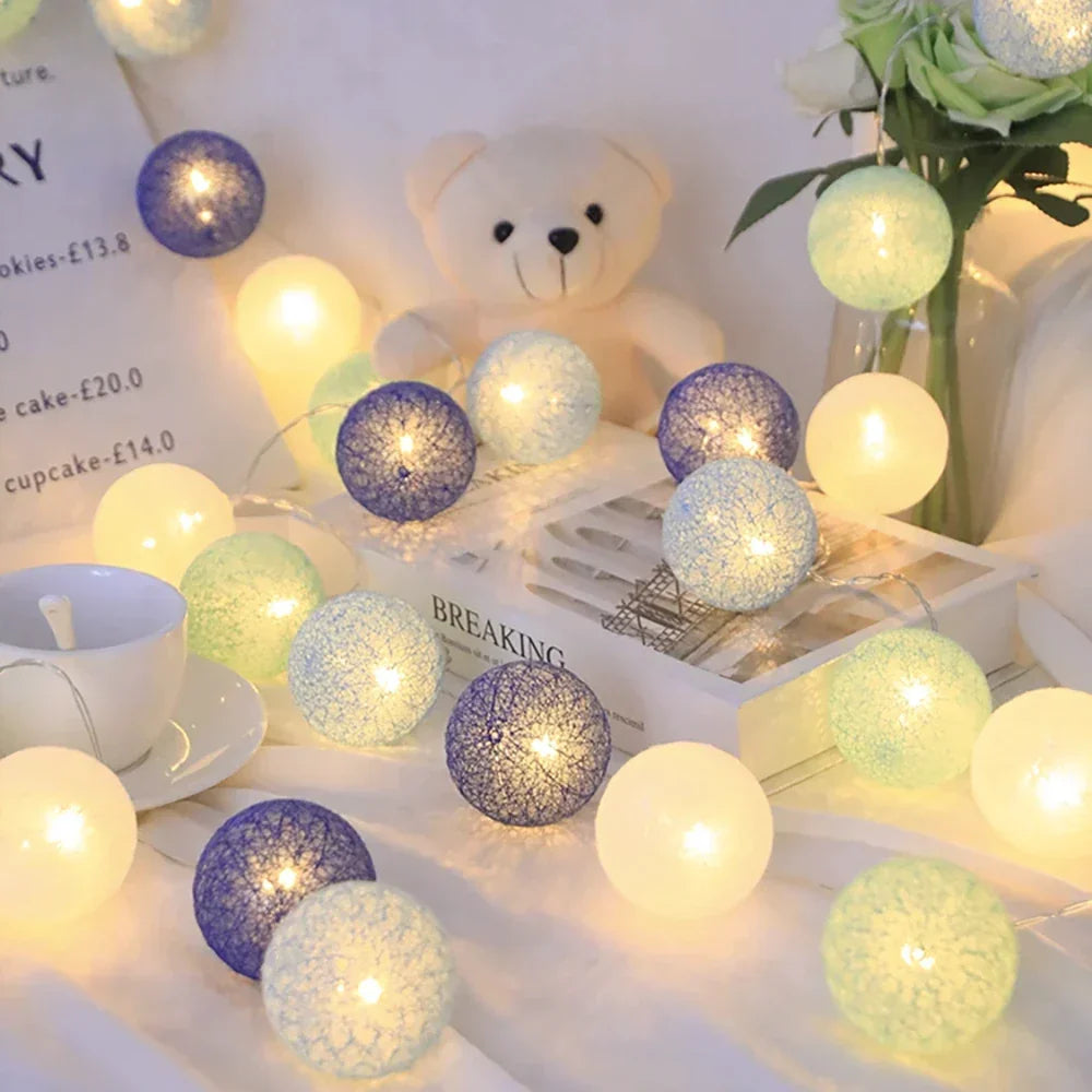 Warm white cotton ball string lights, perfect mood lighting for bedrooms & living rooms.