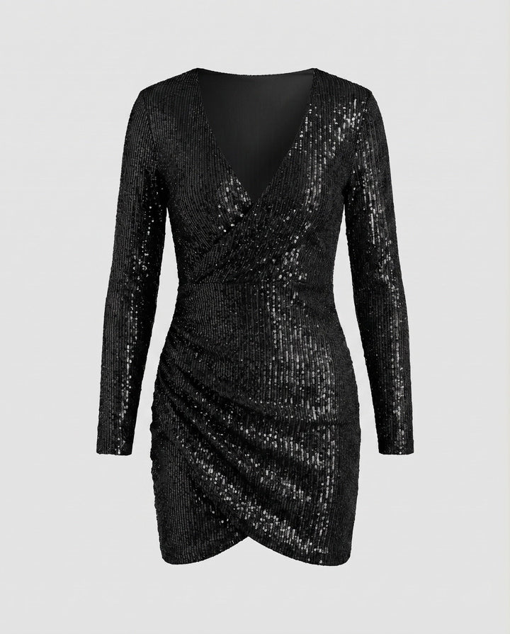 Women's party mini dress featuring a glittering finish, wrap front, long sleeves, and ruffled hem.