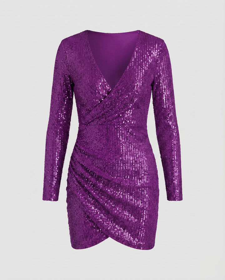 Stylish women's long sleeve shimmer mini dress. Features a true wrap design and elegant ruffle trim.