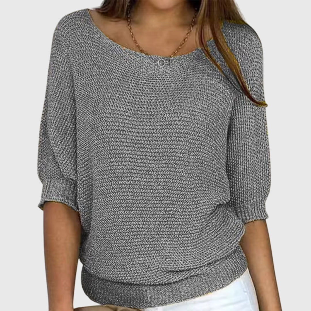 All-season women's relaxed fit knit sweater, offering elegant style and comfortable wear for any look.