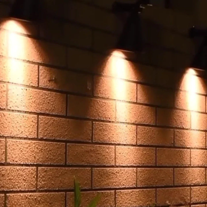 Ground-mountable solar spotlight, ideal for garden borders with customizable RGB & white.