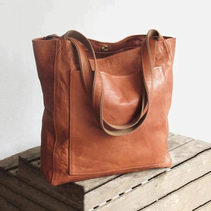 Women's genuine leather spacious shoulder tote bag, ideal for everyday use & work. Elegant fashion accessory.