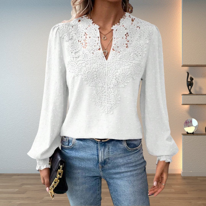 Stylish women's long-sleeve V-neck blouse with elegant lace bodice & trendy smocked cuffs. Dressy fashion top.