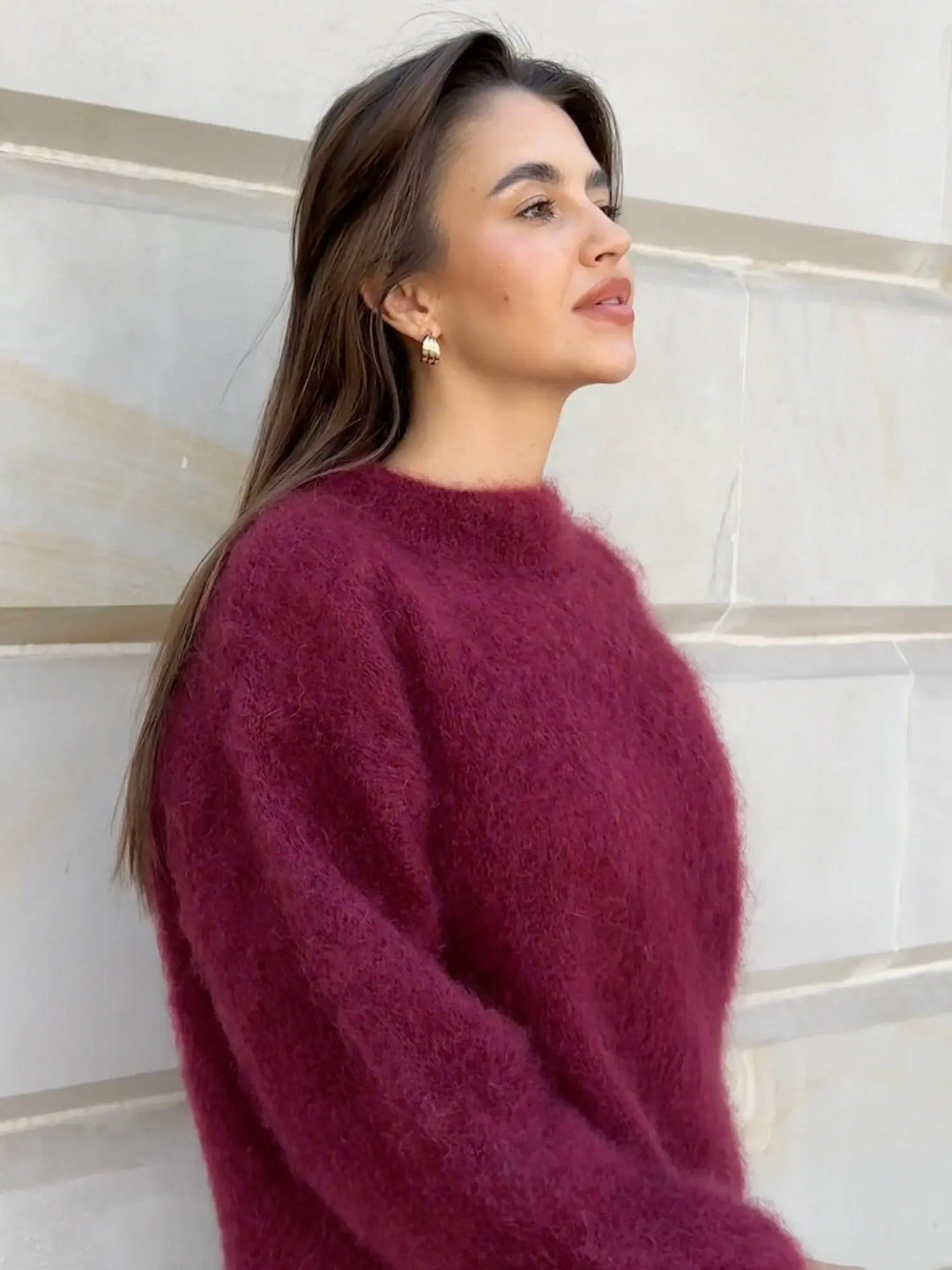 Classic women's knit sweater, elegant long sleeve design, perfect for cozy winter outfits.