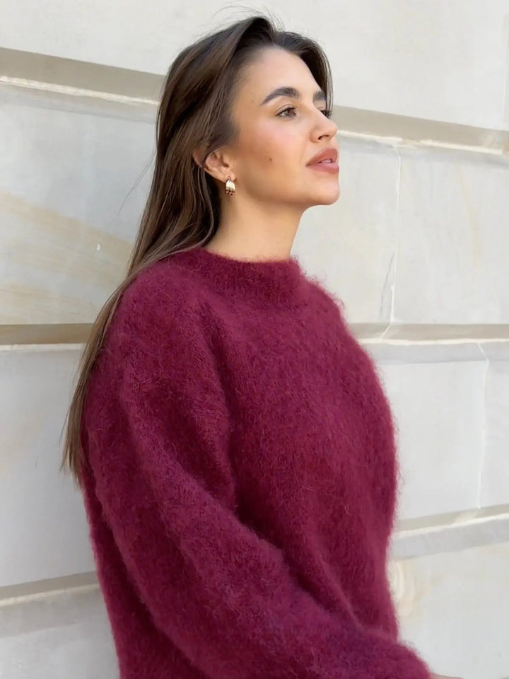 Classic women's knit sweater, elegant long sleeve design, perfect for cozy winter outfits.