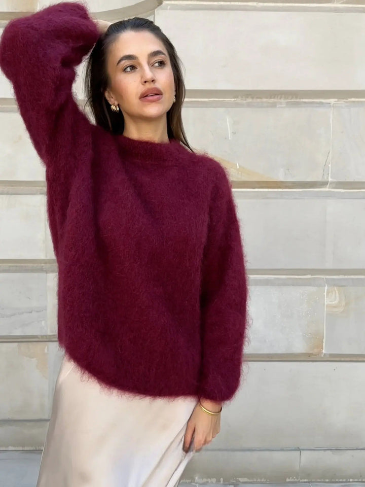 Chic women's long sleeve knit sweater, elegant, cozy, and stylish for fall/winter.