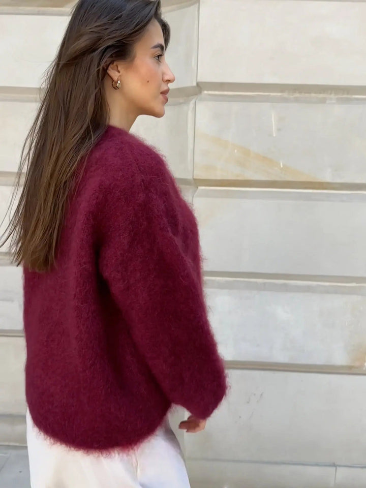 Comfortable women's knit sweater, elegant long sleeve for cozy fall and winter days.