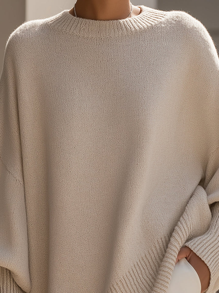 Woman modeling a relaxed fit fall sweater in minimalist style, perfect for casual wear.