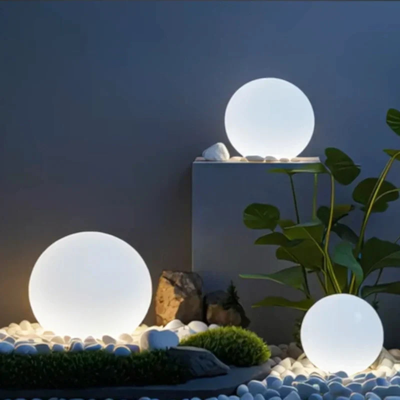 Modern spherical RGB garden light, 16-color LED, remote. Weatherproof, perfect for illuminating patios.