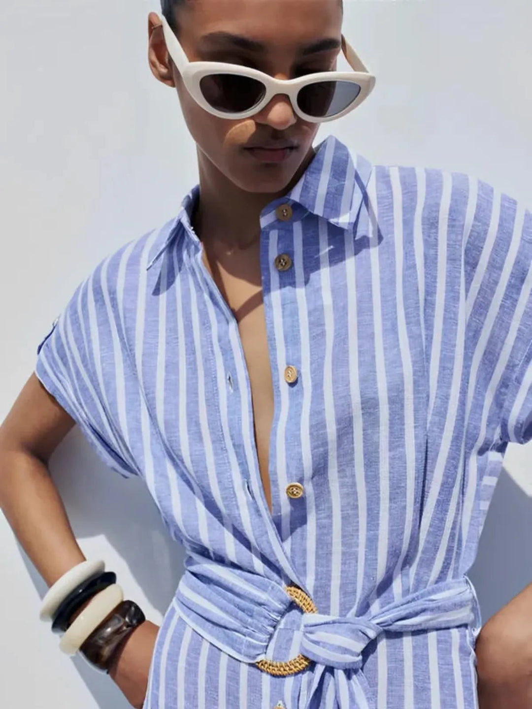 Versatile women's striped button-down maxi dress with belt, great as a summer dress or sophisticated workwear.