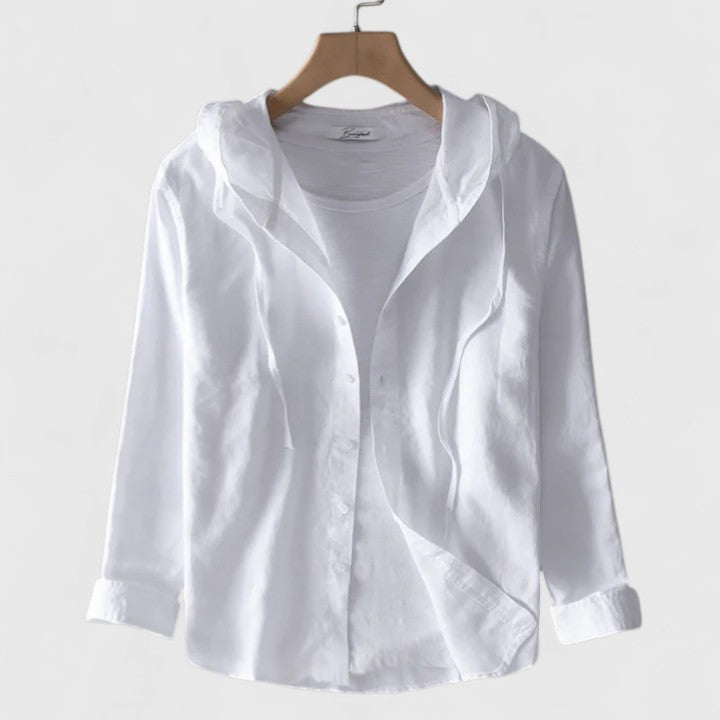 Woman wearing a comfortable hooded long-sleeve blouse, demonstrating its relaxed fit for casual wear.