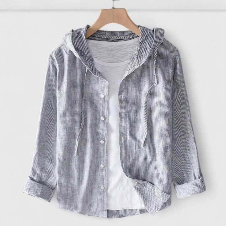 Detailed view of women's hooded long-sleeve blouse, highlighting its comfortable design and versatile style.
