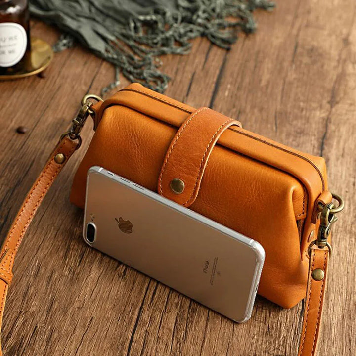 Classic vintage doctor bag style women's handbag, a fashionable PU leather shoulder and crossbody accessory.