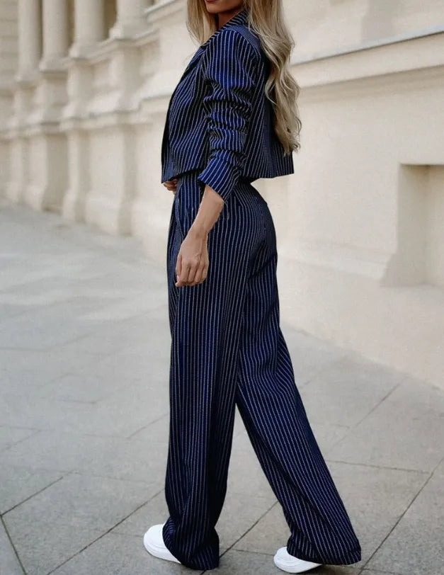 Versatile women's fashion suit with a stylish blazer and comfortable trousers, ideal for professional or smart casual looks.