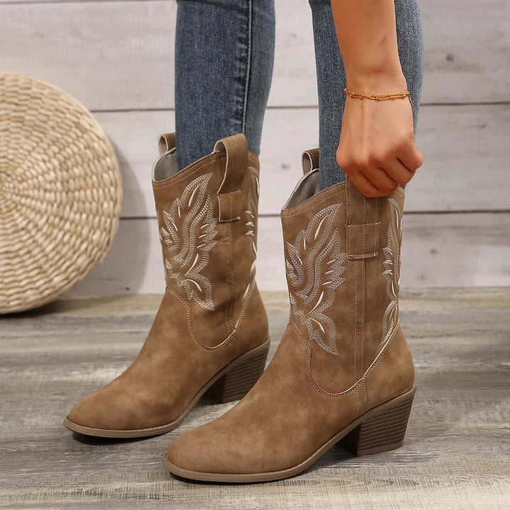 Elegant women's embroidered western ankle boots with a chic pointed toe, comfortable block heel. Ideal for evening wear.