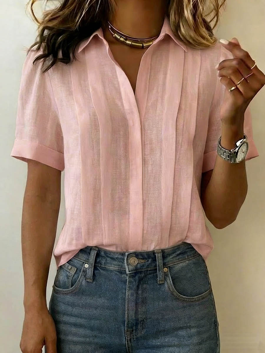 Close-up of a men's stylish short sleeve button-up shirt with unique texture, great for summer fashion.