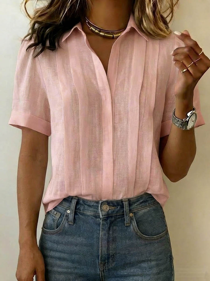 Close-up of a men's stylish short sleeve button-up shirt with unique texture, great for summer fashion.