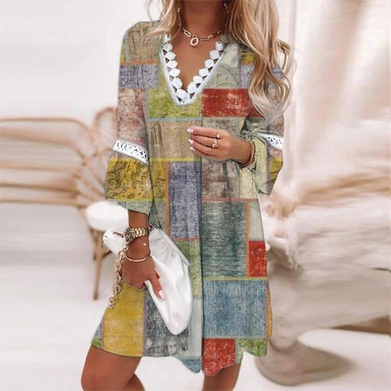 Elegant women's printed mini dress with a bohemian style, versatile for both casual & day fashion.