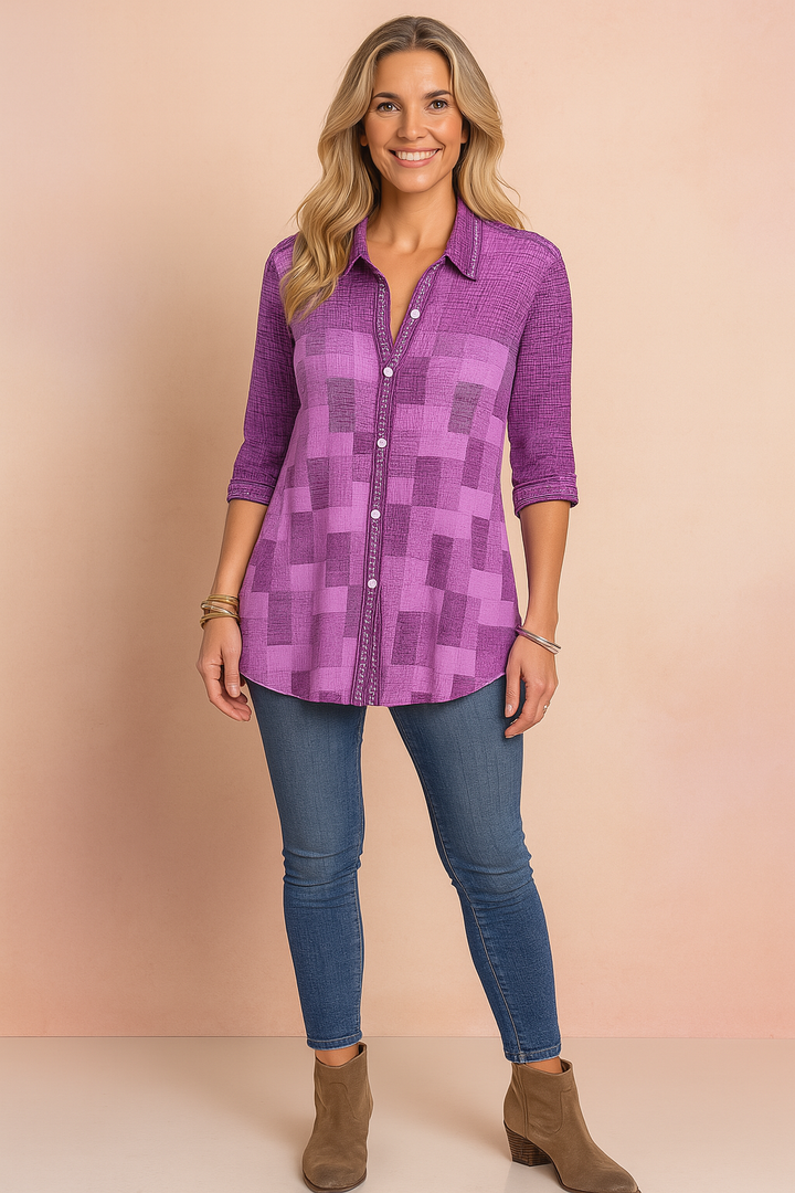 Casual women's button-down shirt in a colorful patchwork pattern, featuring practical 3/4 sleeves for a relaxed look.