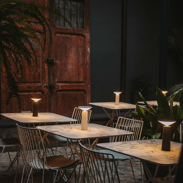 Portable LED lamp, rechargeable and dimmable, with a flexible arm for versatile lighting.