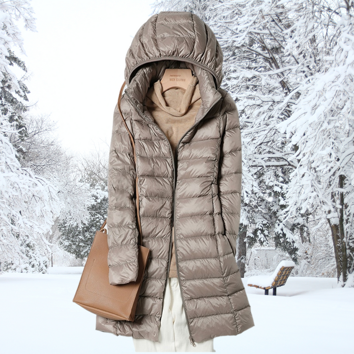 Women's ultralight puffer jacket with quilted design, insulated for winter warmth. Features a comfortable, removable hood.