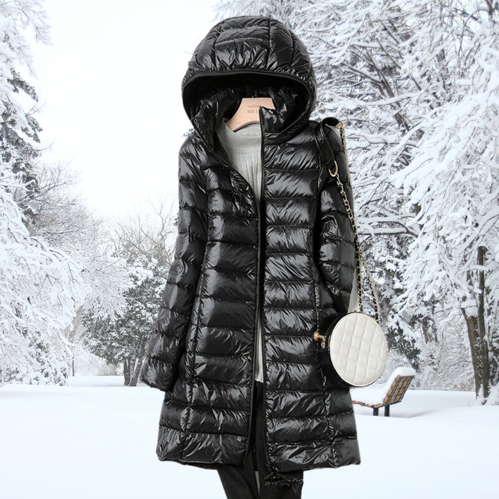 Quilted ultralight women's puffer jacket. Warm, insulated winter coat with a removable hood for versatile style.