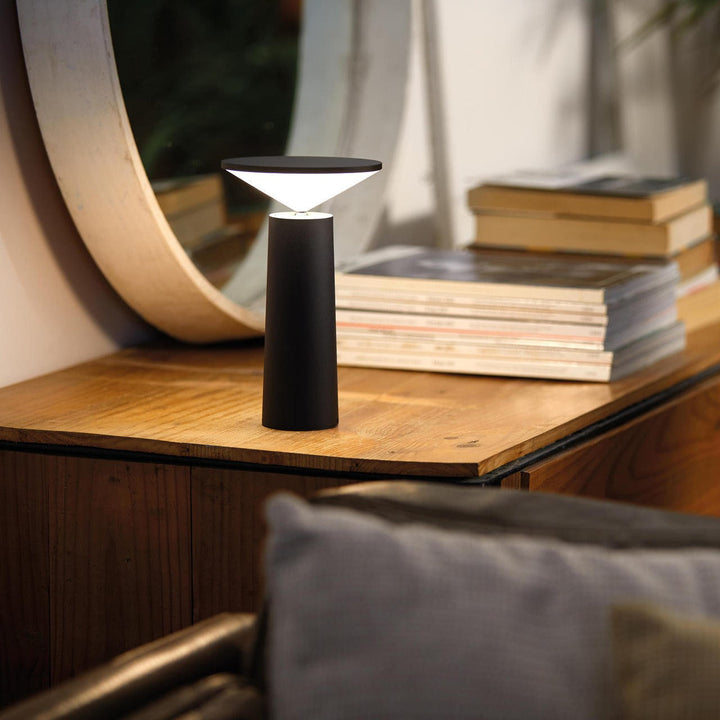 Minimalist dimmable LED desk lamp, flexible arm, provides soft ambient light.