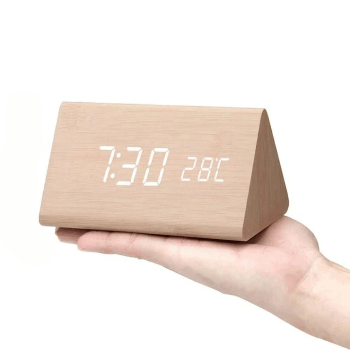 Contemporary LED desk clock with voice command and alarm functions.