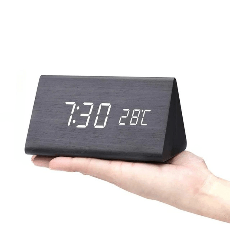 Modern LED clock with sound activated display, time, date, temperature.