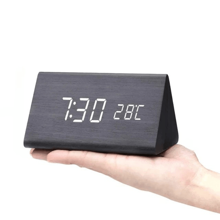 Modern LED clock with sound activated display, time, date, temperature.