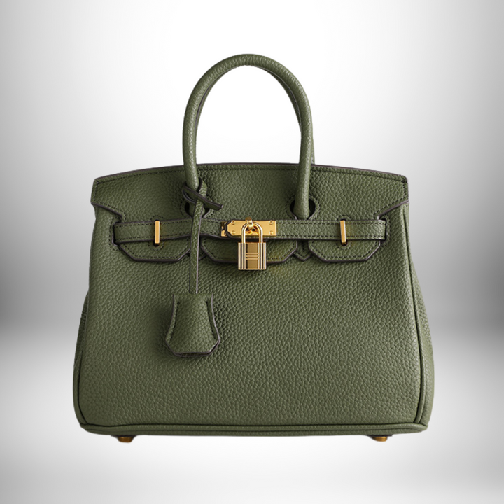 Exquisite women's embossed leather handbag, ideal for a refined look, with gold accents.