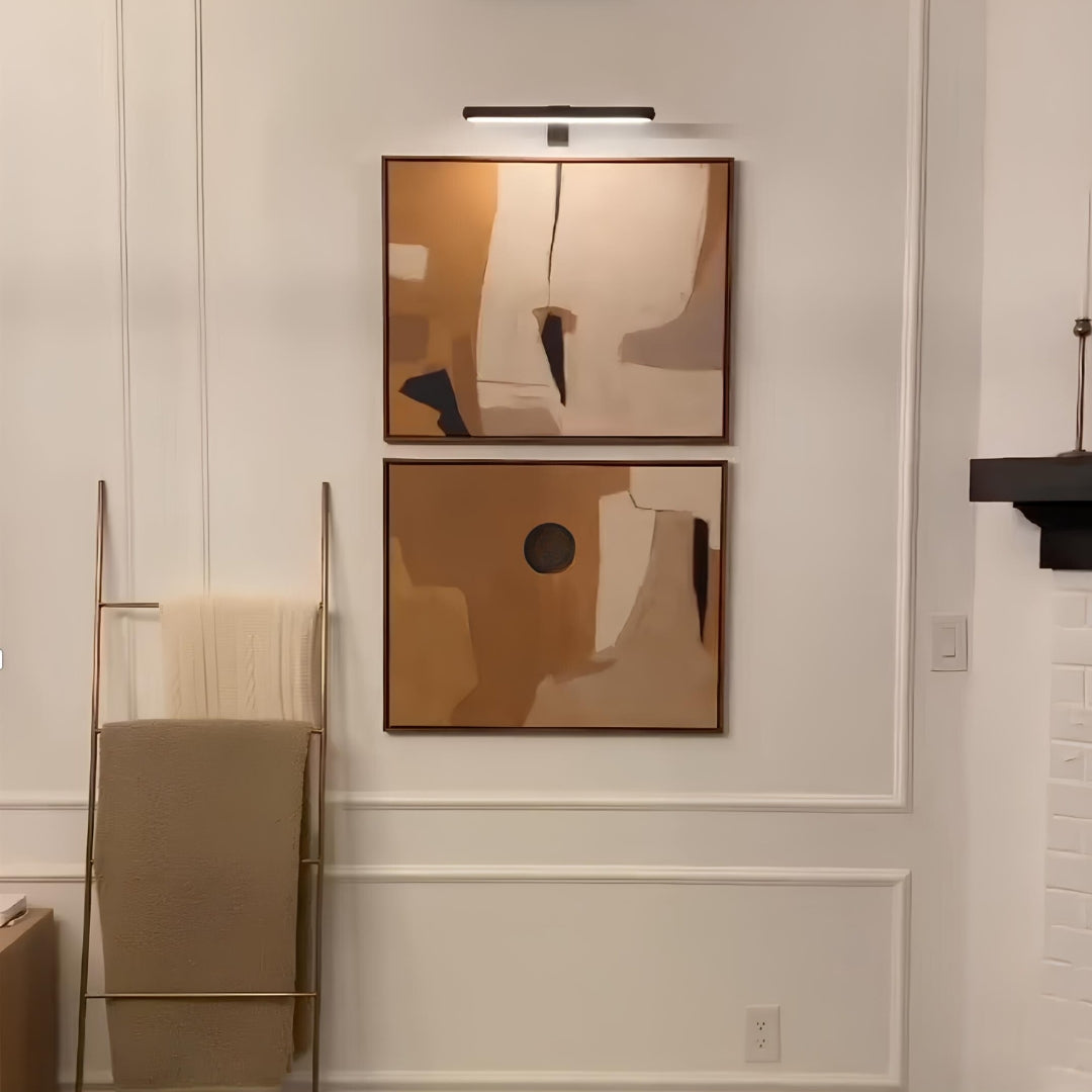 Remote controlled wireless LED wall light, enhancing art pieces & home decor displays.