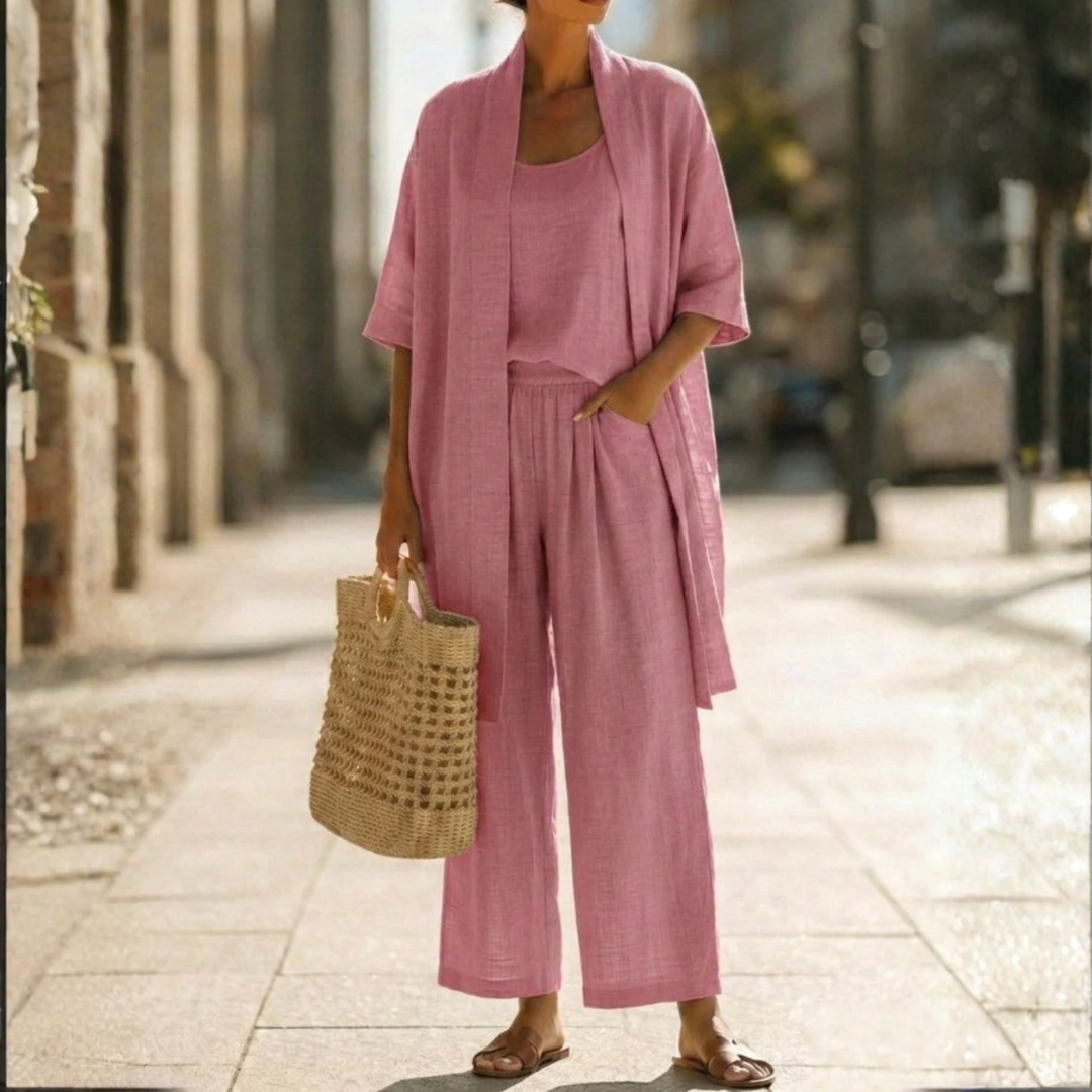 Comfortable & stylish women's 3-piece cardigan set. Features a tank, long cardigan, and straight leg pants.