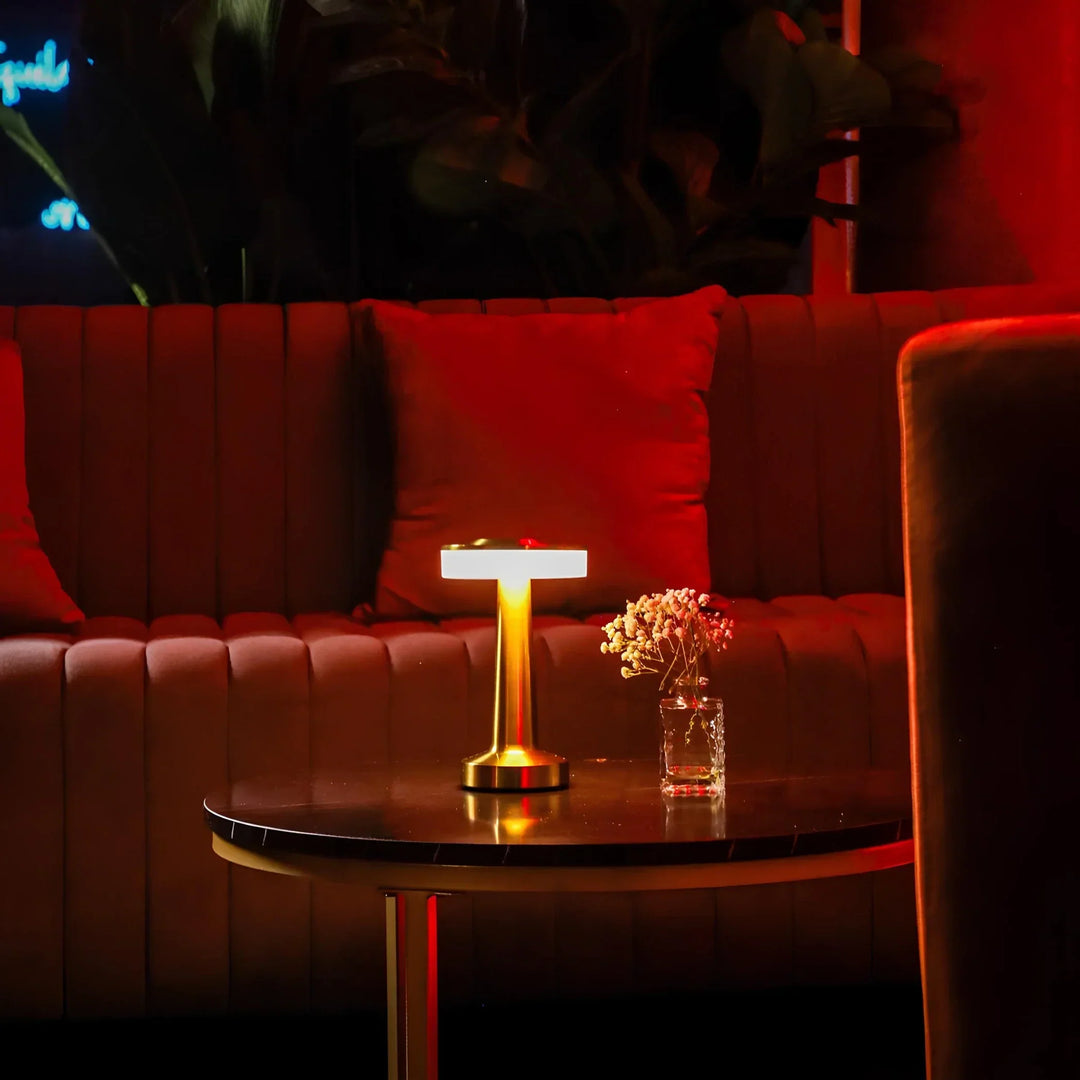 Modern vintage LED bar lamp. Rechargeable, dimmable, and cordless, offering warm ambient light.