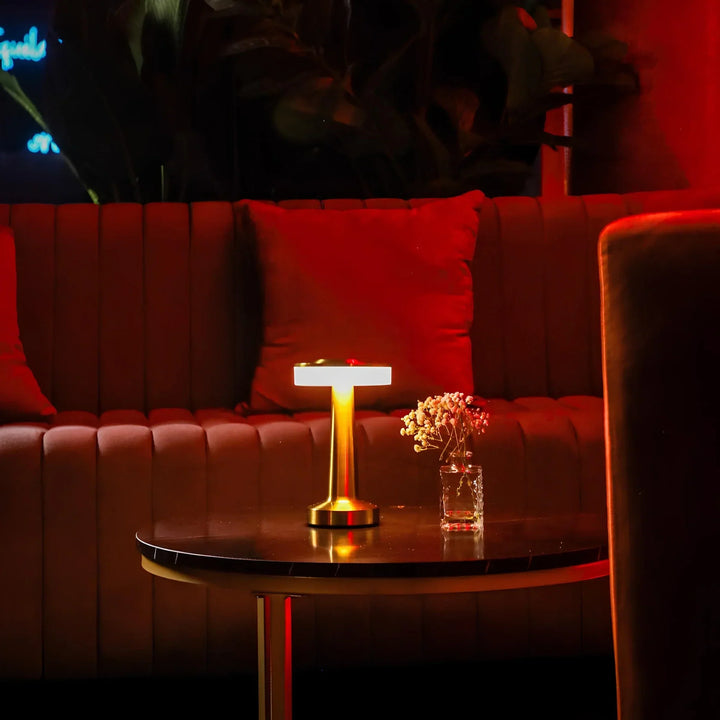 Modern vintage LED bar lamp. Rechargeable, dimmable, and cordless, offering warm ambient light.