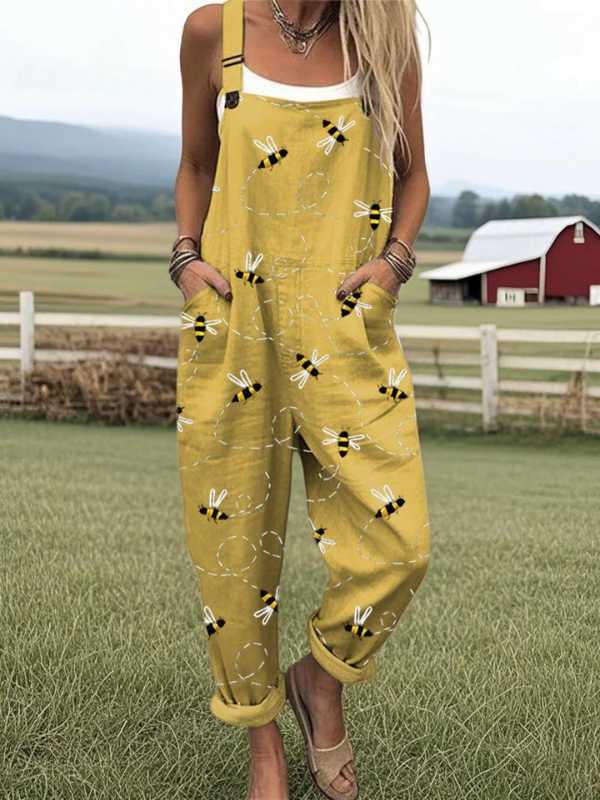 Women's elegant yellow bee print jumpsuit dungarees. Comfortable summer style for playful women's fashion.