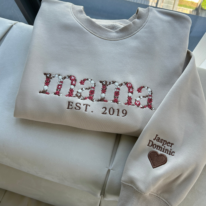 Unisex custom floral sweatshirt, a personalized Mother's Day gift for mom, featuring unique embroidered flowers.