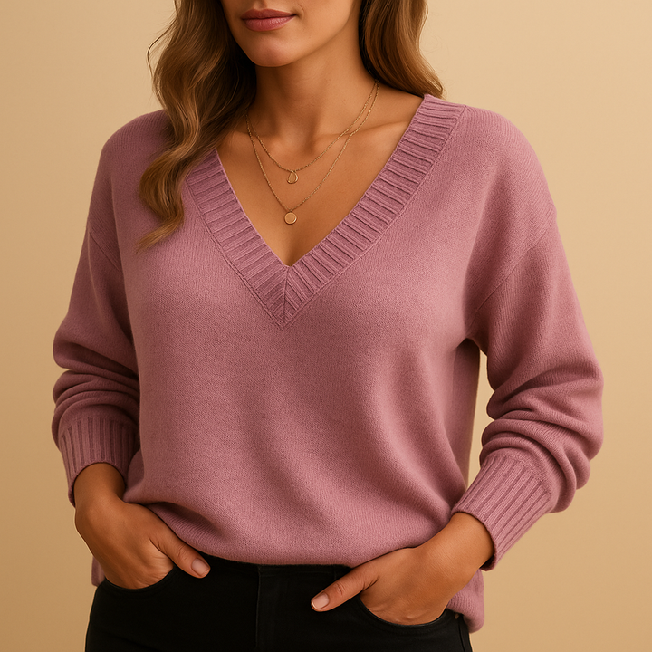 Soft knit women's v-neck sweater. Relaxed fit pullover top, cozy and comfortable for casual or office wear.