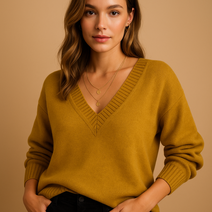 Cozy women's v-neck sweater. Relaxed long sleeve knit top, perfect for fall fashion, winter style & comfort.