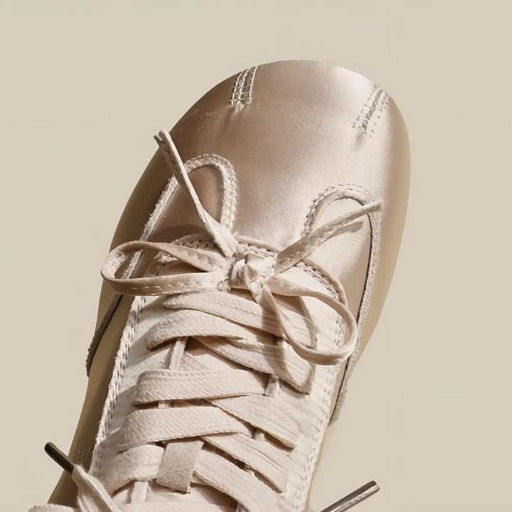 Modern women's elegant sneakers, lightweight and comfortable for casual sophisticated wear.