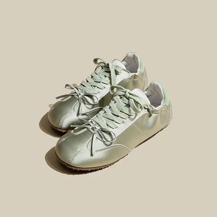 Versatile women's low-profile sneakers, offering lightweight comfort and a stylish, modern aesthetic.