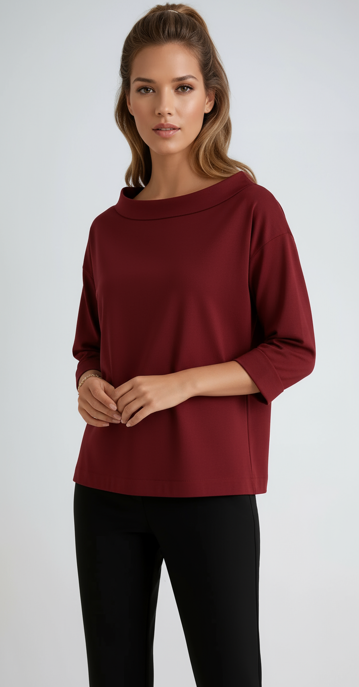 Minimalist women's boat neck 3/4 sleeve top. Relaxed fit offers elegant style, great for casual or office fashion.