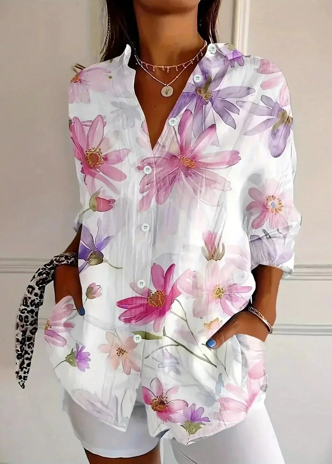 Versatile women's casual top: button-front blouse with practical three-quarter sleeves. Great for summer fashion.