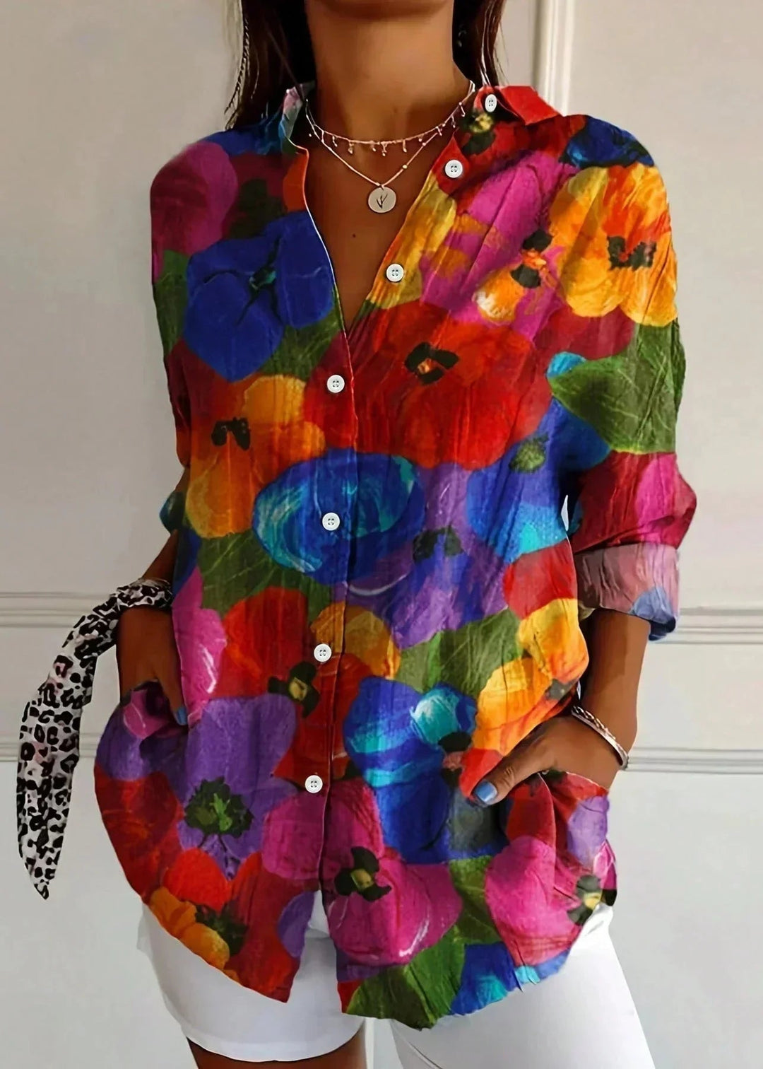 Modern women's button-front top, designed with three-quarter sleeves for a comfortable and fashionable look.