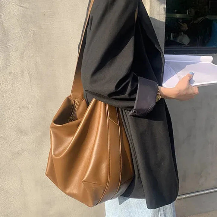 Faux leather women's slouchy tote bag, a stylish and practical shoulder handbag accessory.