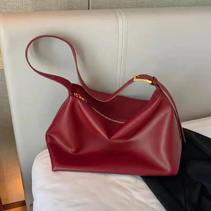 Smooth faux leather women's slouchy shoulder tote bag, a stylish fashion accessory.