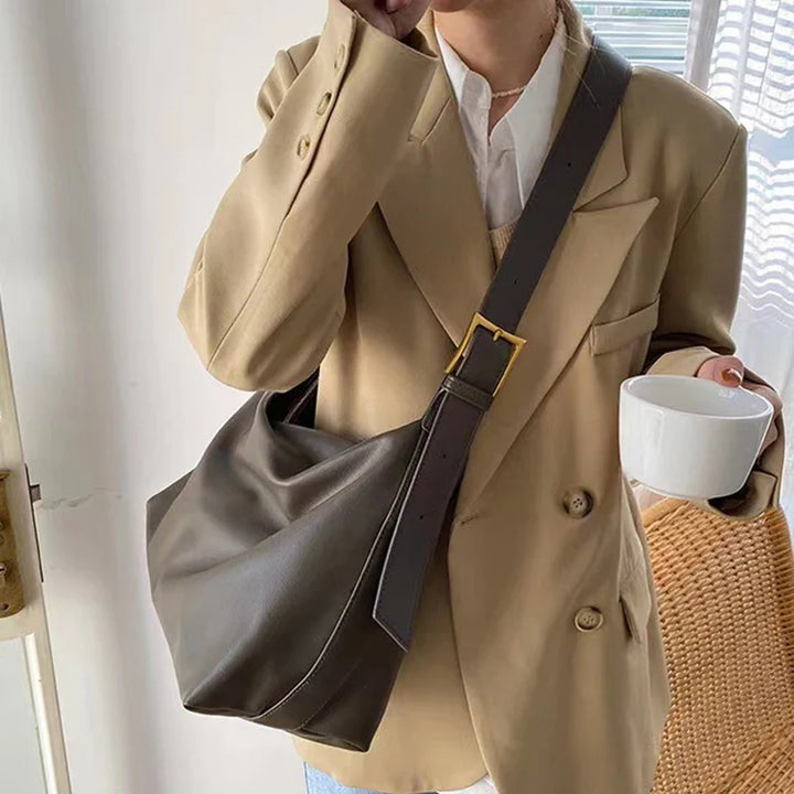Trendy women's slouchy faux leather shoulder tote bag, a spacious & chic everyday handbag.