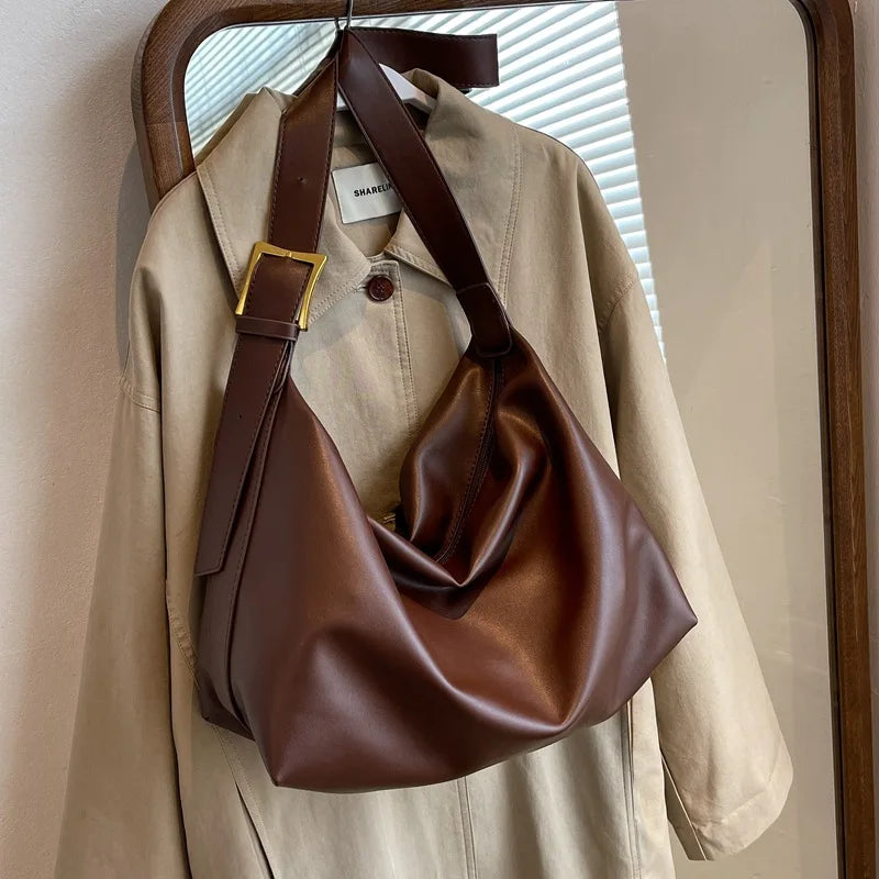 Versatile women's slouchy faux leather tote bag, a chic shoulder handbag for any outfit.