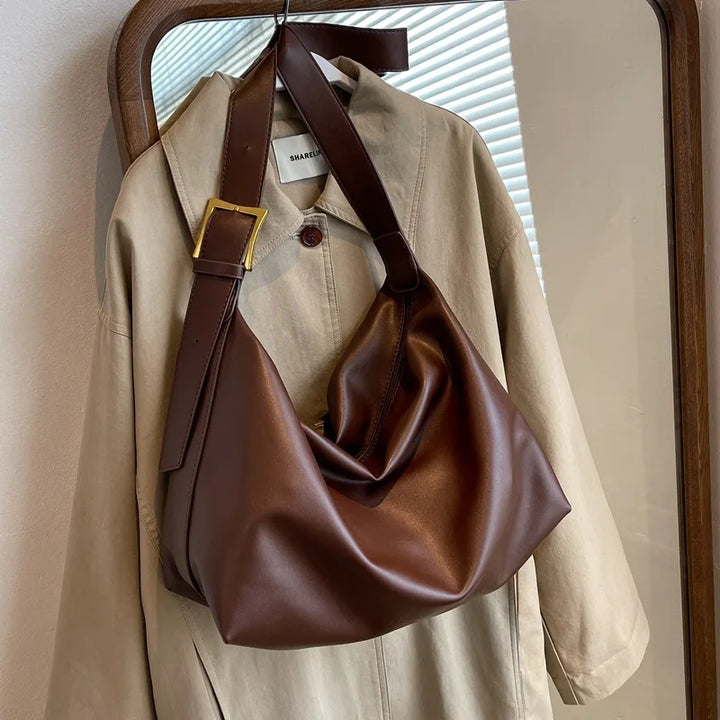 Versatile women's slouchy faux leather tote bag, a chic shoulder handbag for any outfit.