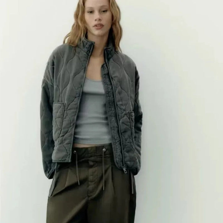 Stylish women's vintage quilted winter jacket, a warm outerwear piece for elegant autumn & winter fashion.